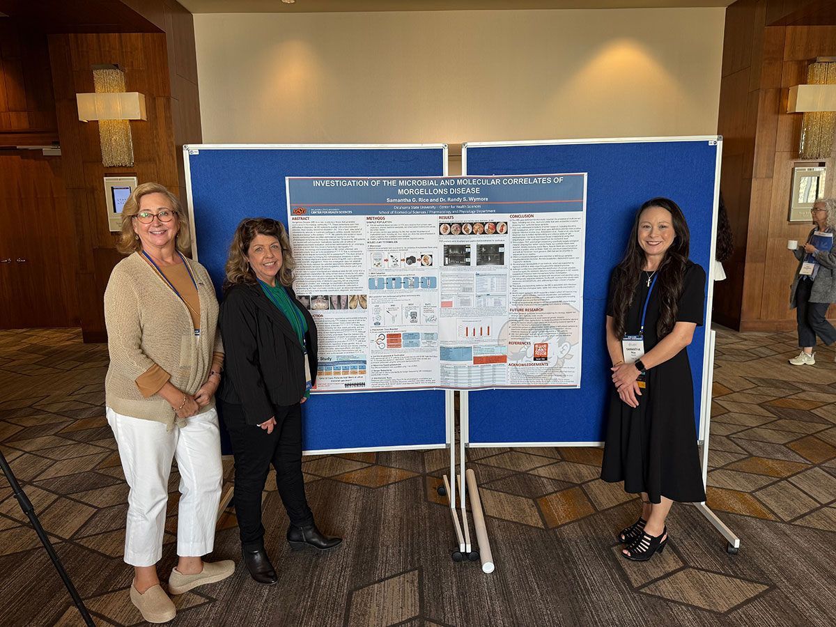 Deb Corrigan, Cindy Casey-Holman and Samantha Rice with Poster Presentation